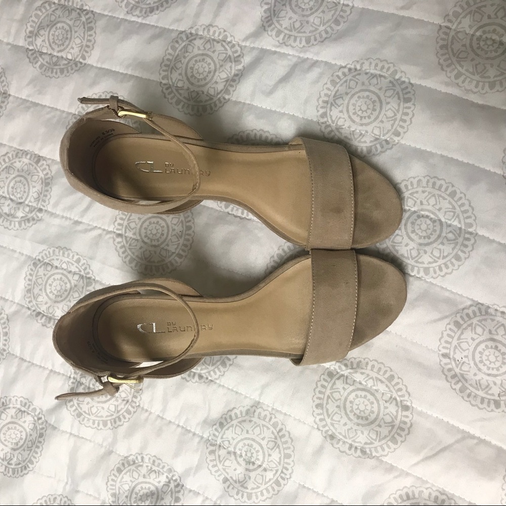 Nude pumps with ankle strap.